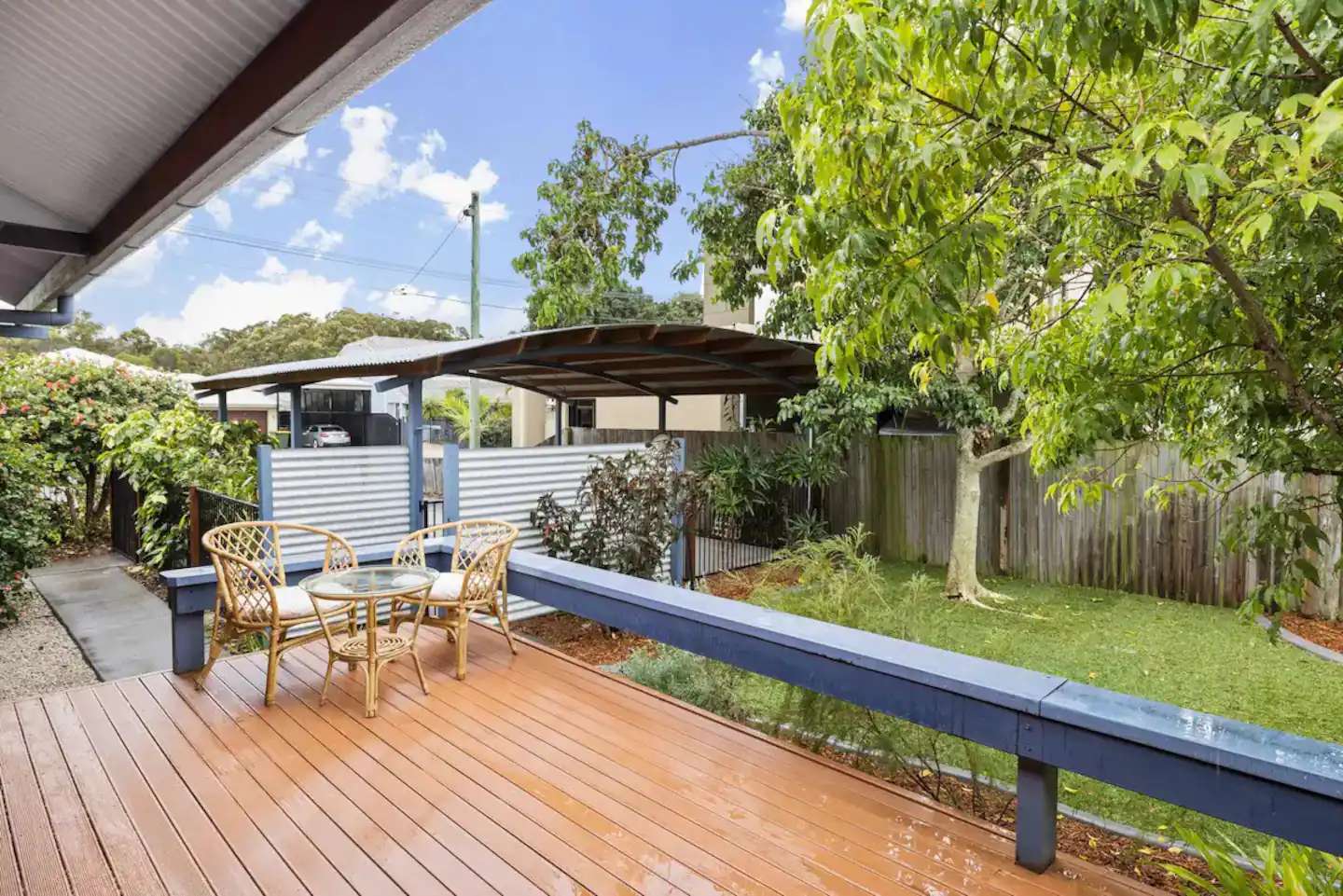Timber side deck overlooking the garden and fenced pool area